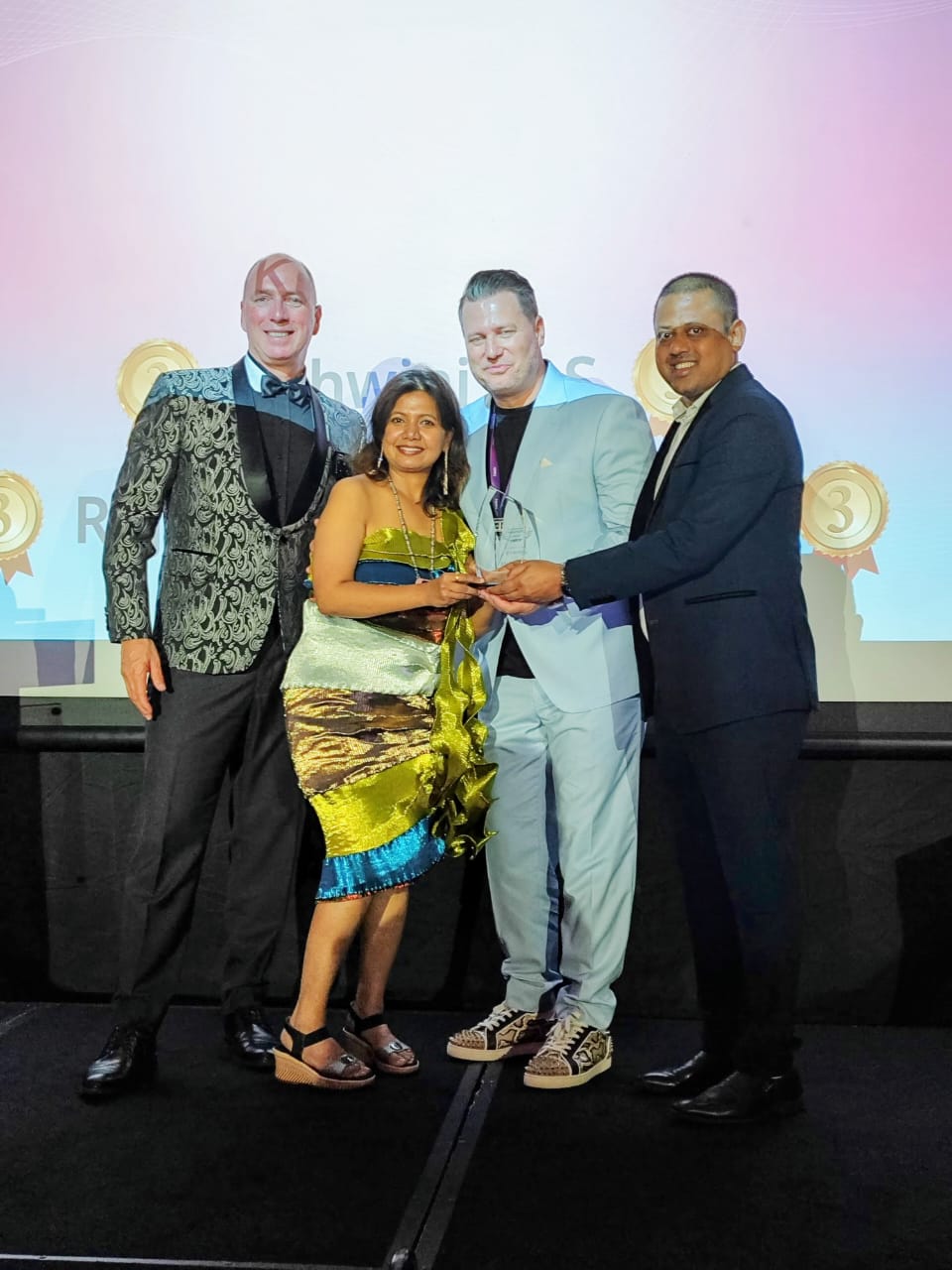 Ashwini receiving a healing and wellness award
