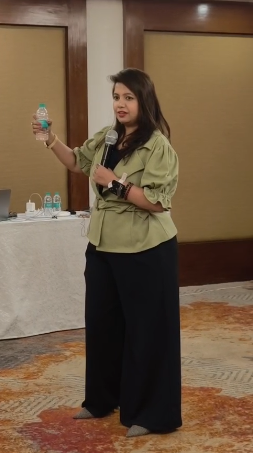 Ashwini speaking at a live workshop
